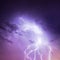 Lightning in purple sky