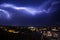 Lightning in the sky in the city weather anomaly disaster