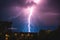 Lightning storm with huge electrical discharges on night sky, thunderstorm background