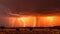 Lightning storm at sunset. Lightning strikes at dusk during the monsoon season. Spectacle of nature: lightning lights up the sky