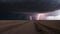 lightning in the storm A terrifying scene of a tornado and a lightning storm over a field