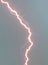 Lightning strike closeup - big light beam - electric discharge during the storm - storm landscape