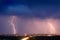 Lightning strike over city in purple light