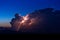 Lightning strike from a thunderstorm cumulonimbus cloud