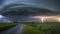 Lightning strikes the road through the field. Stormy weather.