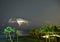 Lightning takes over the ocean horizon as a storm rages off the shoreline