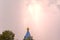 Lightning during a thunderstorm in the sky above the dome and cr