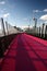 Lightpath to CBD. Urban walk in red color for bicycles to downtown. Nelson Street Cycleway, Auckland, New Zealand