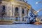 The lights of cars passing in front of University of Sofia