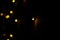 Lights with dark background indoor decorations celebration close up view blurred