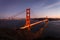 Lights illuminate the Golden Gate Bridge at twilight San Francisco