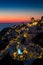 Lights of Oia village at night, Santorini, Greece.