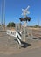 Lights and signs at a three-line railway crossing