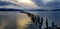 Lights of the sunset over the remains of the pier, Puerto Natales, Chile