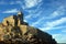 Liguria: the Saint Peter church of Portovenere on the cliff rockview and blue sky with clouds from the boat in the afternoon