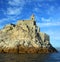 Liguria: the Saint Peter church of Portovenere on the cliff rockview and blue sky with clouds from the boat in the afternoon
