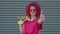 Like and dislike sign. A pink curly girl is showing thumb up and down. Casual teenager is expressing disagreement and