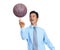 Like a kid again. An isolated shot of a happy businessman spinning a basketball on his finger.