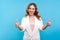 Like! Portrait of pleased optimistic smiling lady showing thumbs up gesture, doing success sign with hand. blue background