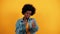 Like. Thumbs up gesture. Happy young African American woman showing Thumbs up gesture on yellow background gives