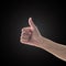 Like - unlike hand with thumb up - down symbolic people gesture  on black background with clipping path