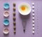 Lilac background food knolling walnut greek seeds sunflower sugar cube refined corolla egg in round bowl cake mold flour blue pink