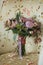 Lilac beautiful wedding bouquet with berries, standing on a white armchair with an overhead