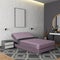 Lilac beds in the interior against the background of a white brick wall. 3D rendering