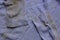 Lilac brown fabric texture of old clothes stained with sleeves