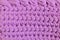 Lilac crocheted texture made of knitted cotton yarn. Lilac handmade background - crafts and hobby