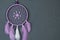 Lilac dream catcher on dark gray