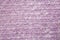 Lilac fabric with large knitted fibers closeup background
