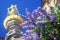 Lilac flowers and golden church cupolas