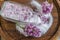 Lilac flowers and sugar on a wooden board