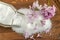 Lilac flowers and sugar on a wooden board