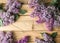Lilac frame on the wood background