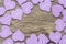 Lilac heart on a wooden surface. The wooden background with heart.Lilac heart