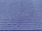 Lilac or purple striped ribbed fabric. Close-up shot of a dish washing sponge or microfiber cloth. Soft focus