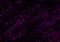 Lilac splashes of paint on a black background. Trace random paint splashes. Splashes of paint like a starry sky