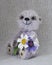 Lilac teddy-bear a bunch of flowers
