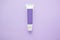 lilac tube cream of personal care cosmetics on a lilac background, place for your name