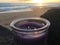 Lilac and Violet Candle Burning with Two Flames during Sunset at Beach in Kekaha on Kauai Island, Hawaii.