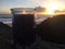 Lilac and Violet Candle Burning with Two Flames during Sunset at Beach in Kekaha on Kauai Island, Hawaii.