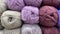 Lilac and white range of wool yarn.