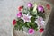 Lilies and and pink roses on bamboo table