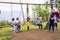 Liliw, Laguna, Philippines - Weekend tourists enjoy the swing at Esmeris Farm, a campsite and local attraction