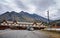 Lillooet, BC, Canada - October 2, 2019.  Wooden Reynolds Hotel on the background of the Coast Mountain Range