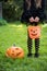 Lillte girl with candy bucket in halloween costume