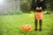 Lillte girl with candy bucket in halloween costume