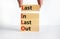 LILO last in last out symbol. Concept words LILO last in last out on wooden blocks. Beautiful white table white background.